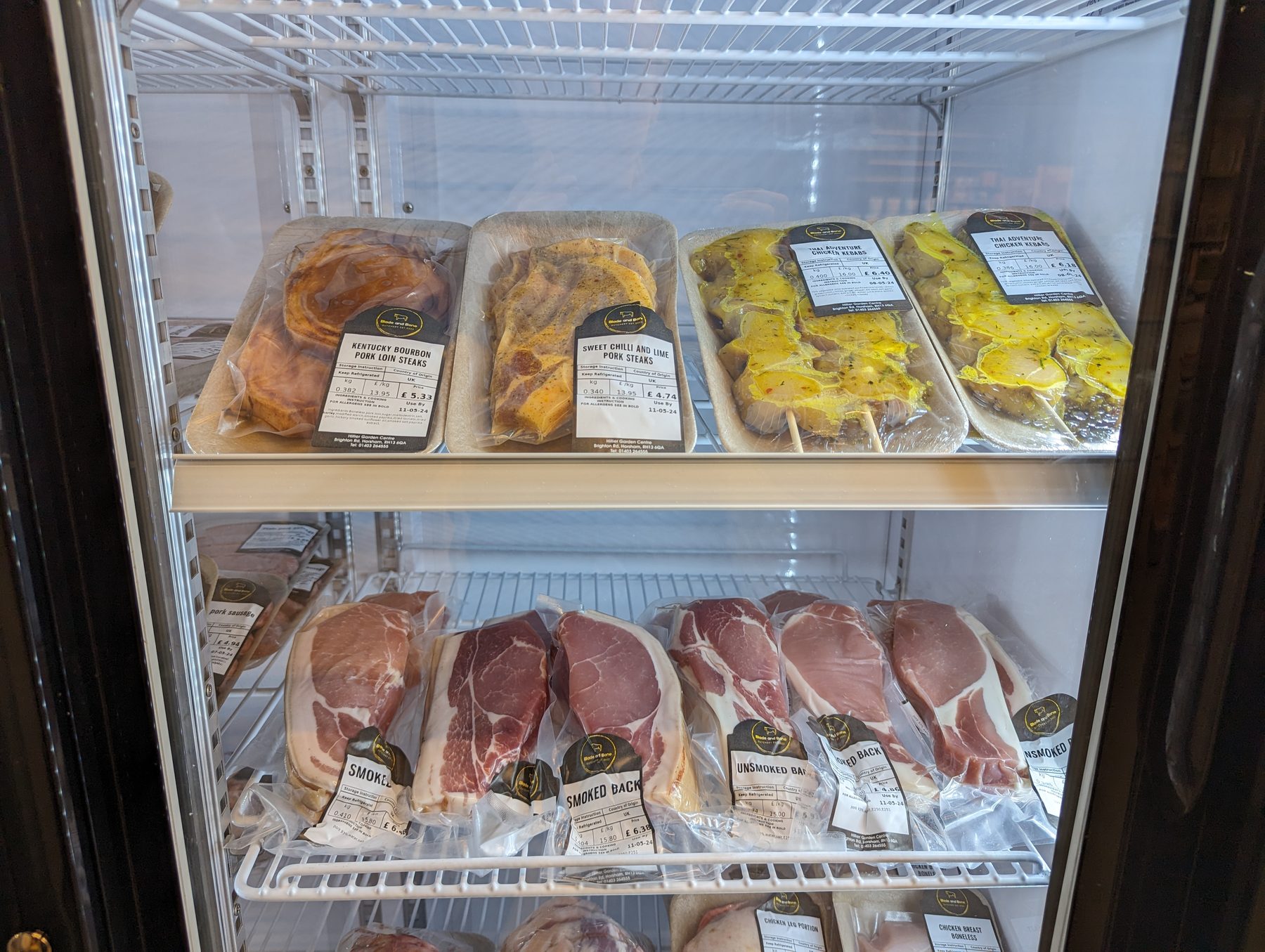 Blade and Bone pork steaks and chicken kebabs in the shop fridge