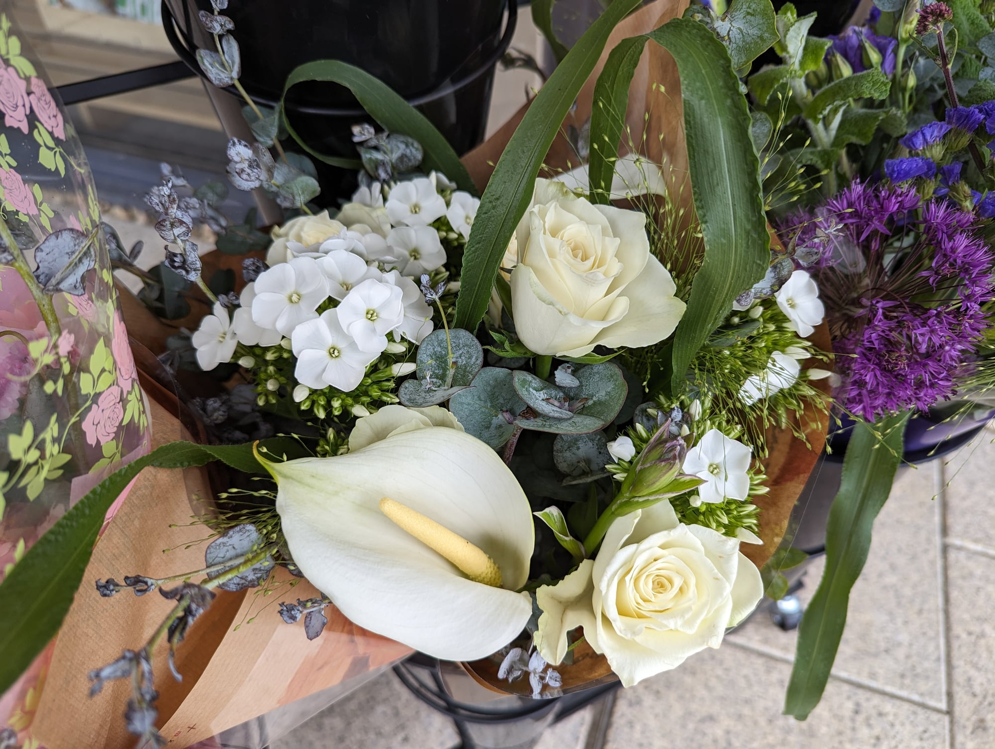 A white rose and calla lily bouquet from Holmbush Flowers