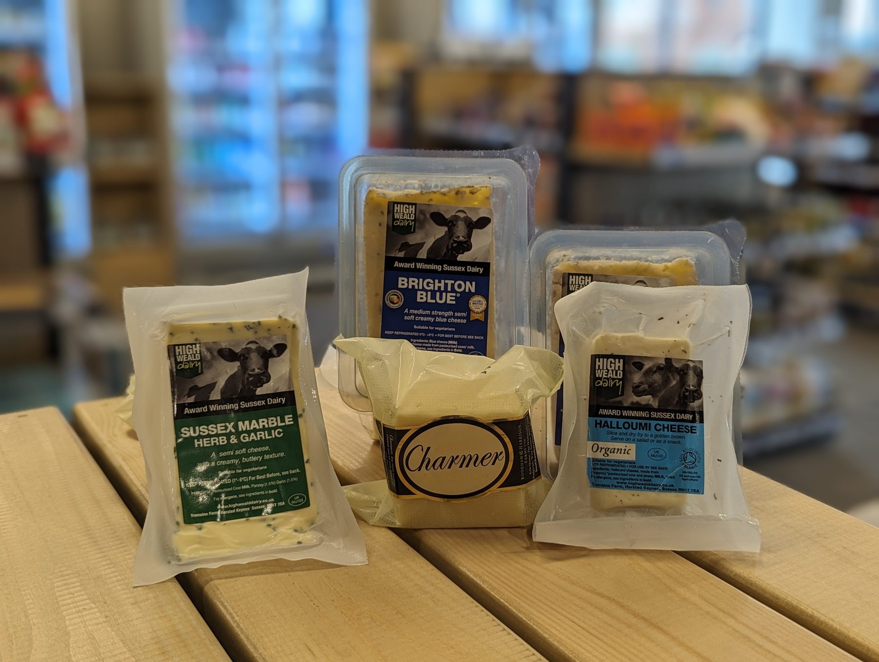 Sussex cheeses displayed inside Woodgate Community Shop